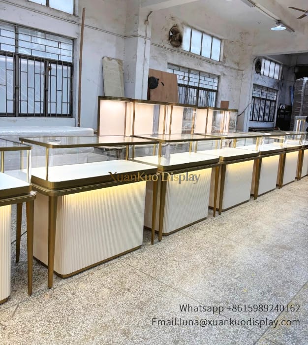 Modern jewelry showcase counter with tempered glass top and built-in LED lights for boutique jewelry store