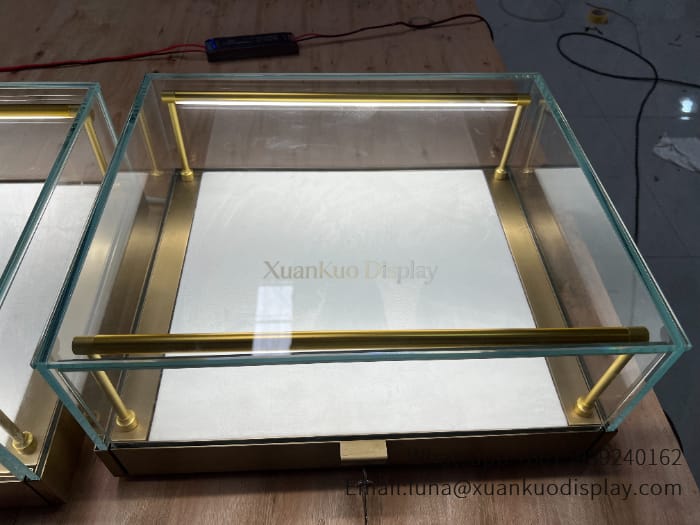 jewellery shop interior design Vietnam display case brushed brass frame sliding glass showcase