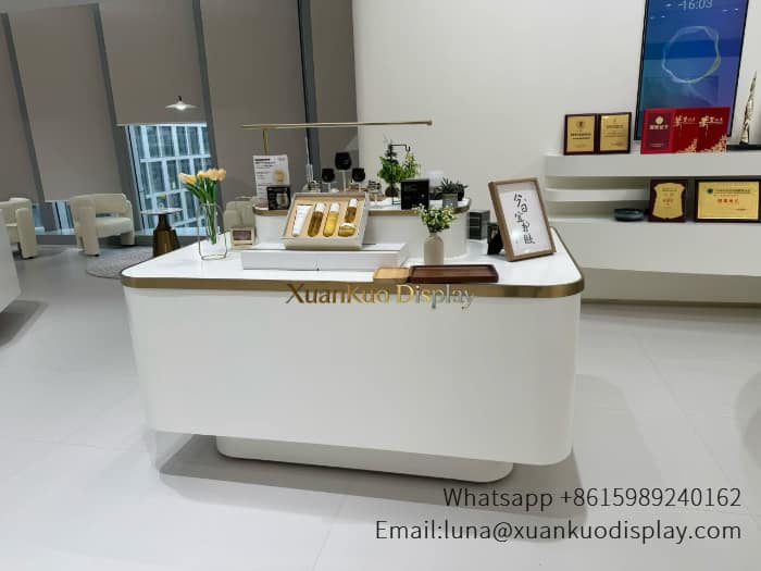 glass jewellery display cabinets white gold trim curved skincare central display island beauty retail counter