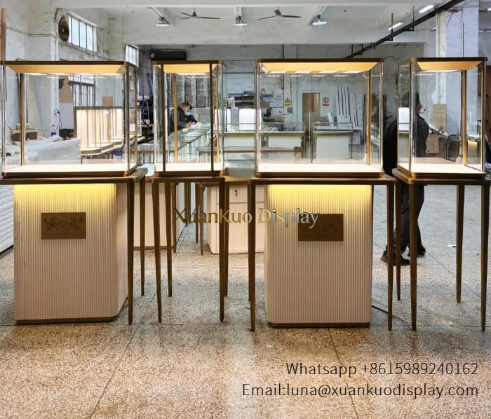 jewellery shop interior design Vietnam bronze metal stainless steel with fluted storage cabinet base for luxury retail jewelry display