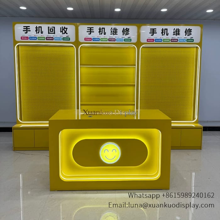 jewellery shop interior design Vietnam yellow led lit phone accessories display rack wall mounted slatwall showcase